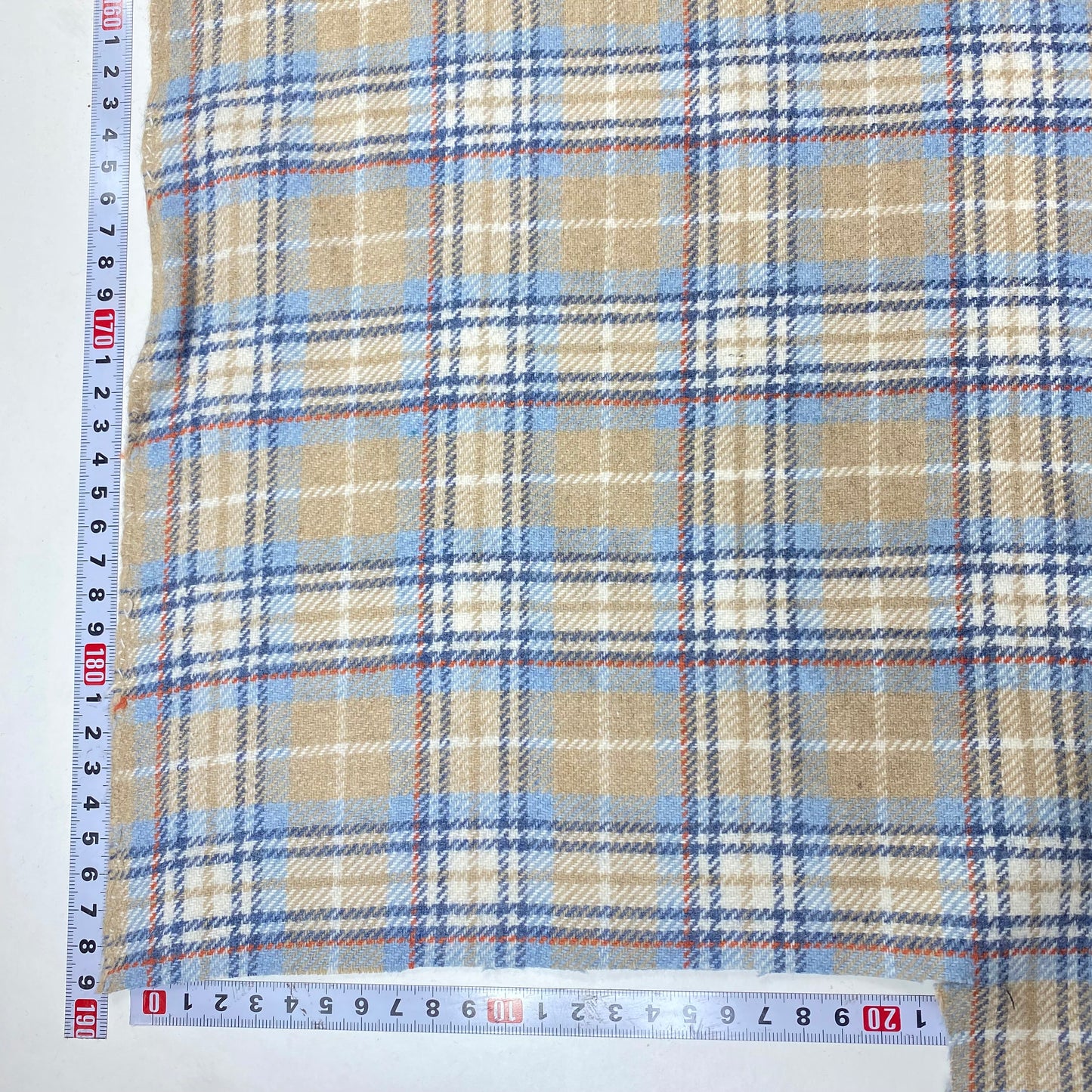 Fine beige, baby blue, and striped fabric