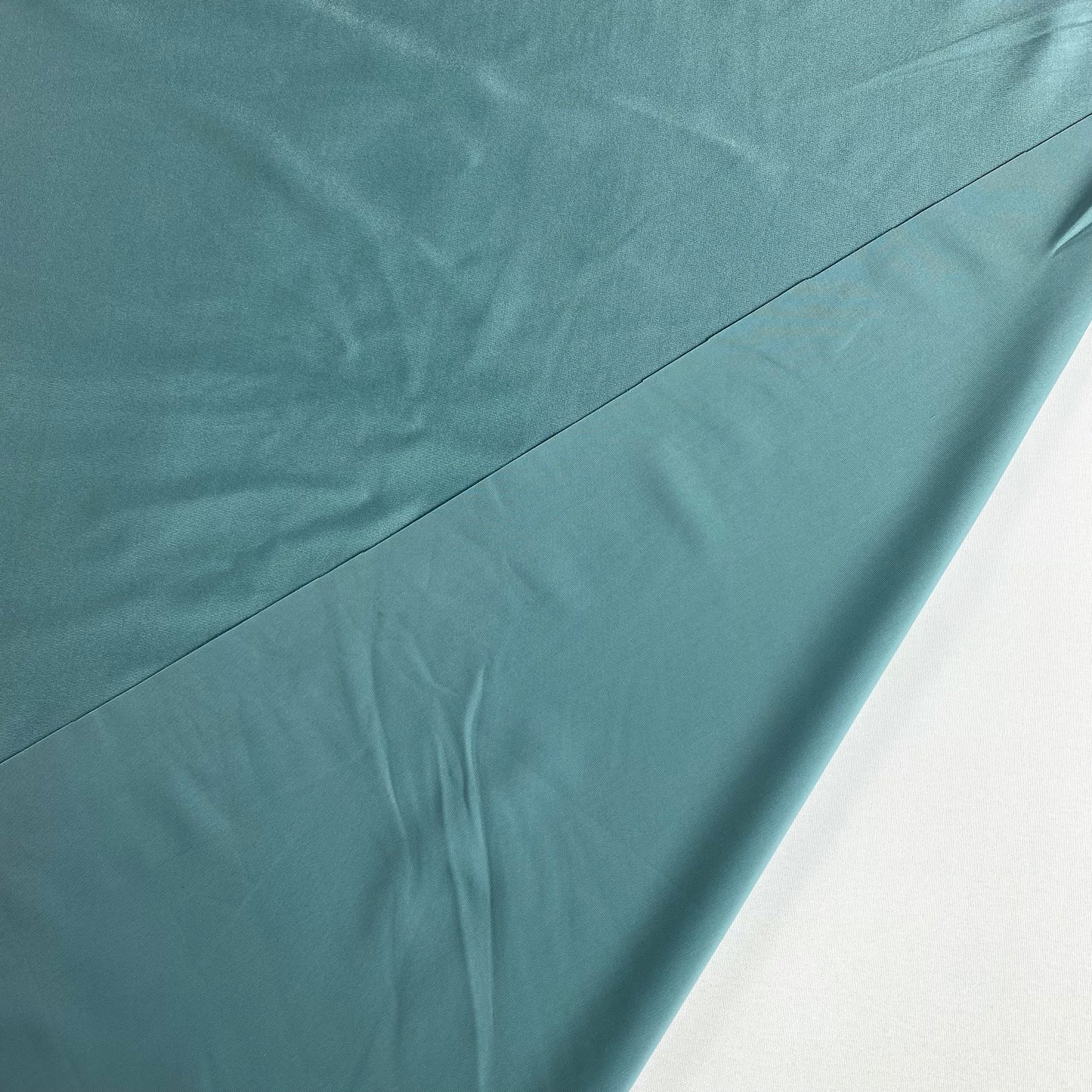 Lycra with a greyish-green sheen.