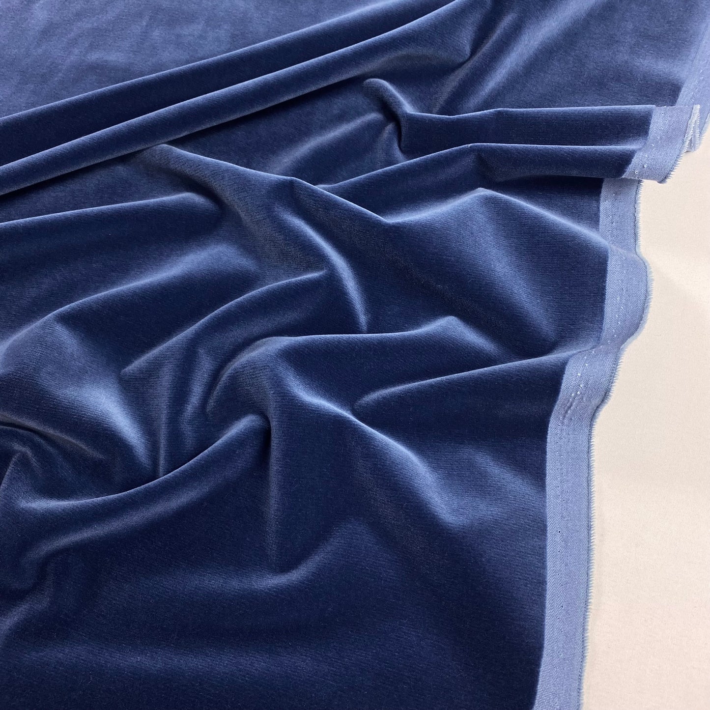 100% cotton velvet in denim blue.