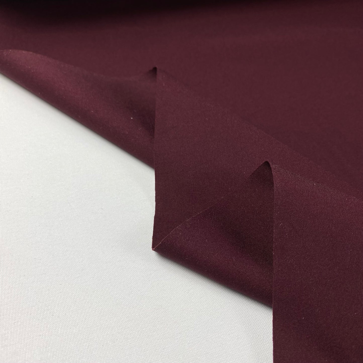 Lycra cor tinto com algum brilho