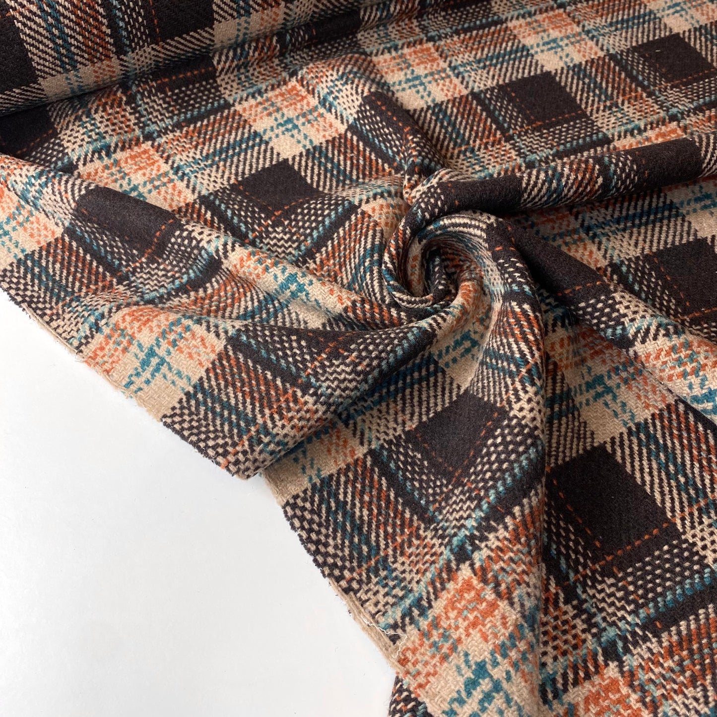 Brown and beige farmhouse with orange and green stripes.