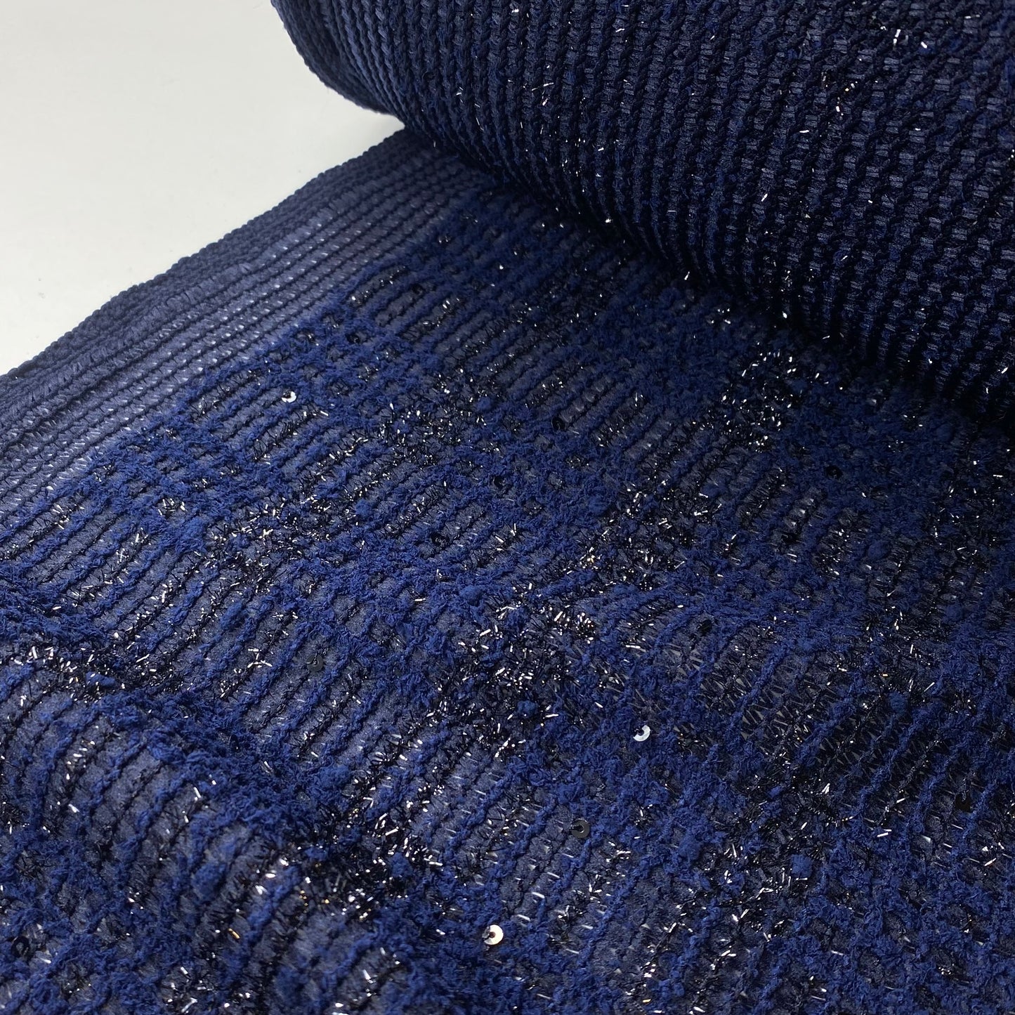 Tejido de punto brillante negro y azul marino