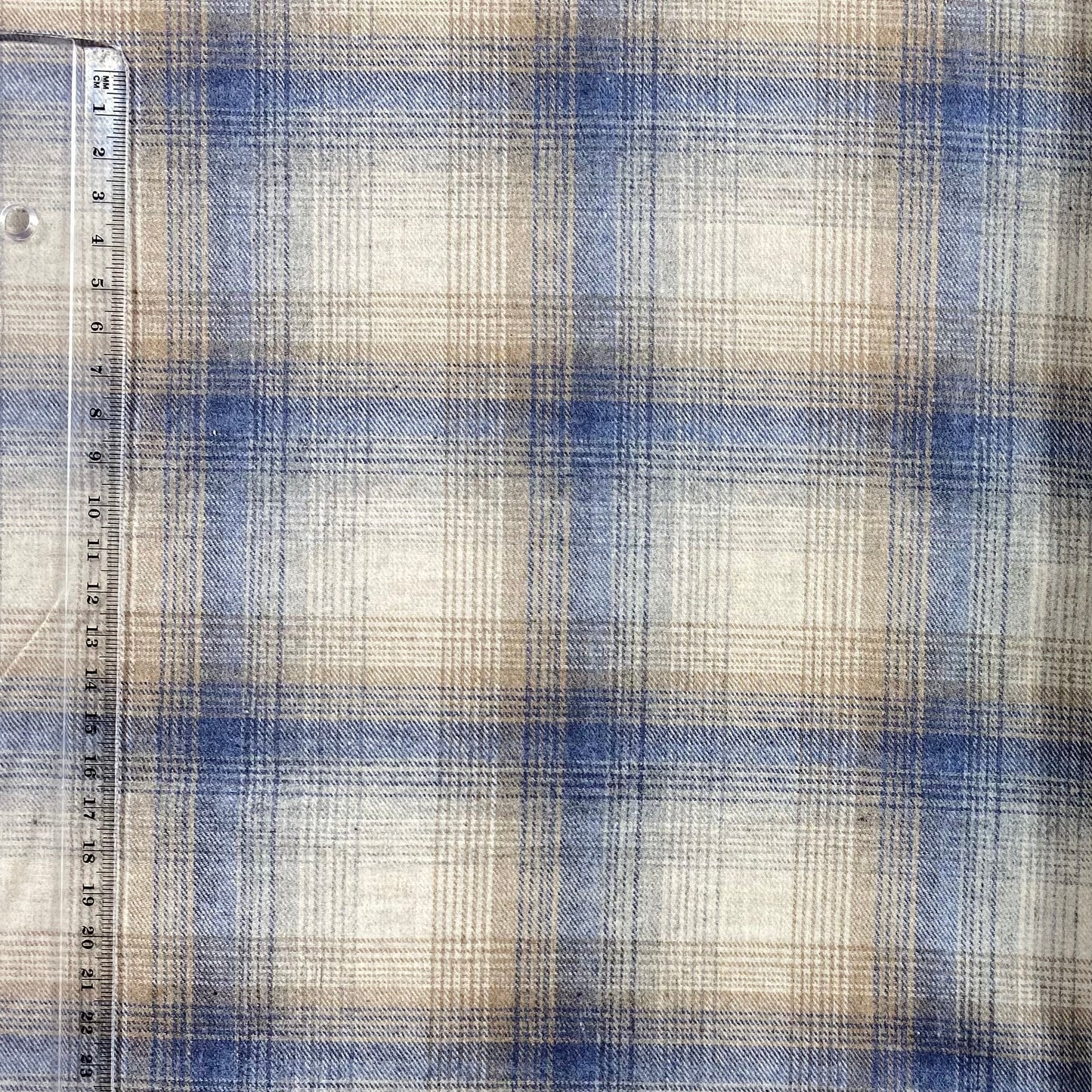 Vaiela beige con rayas azules y doradas
