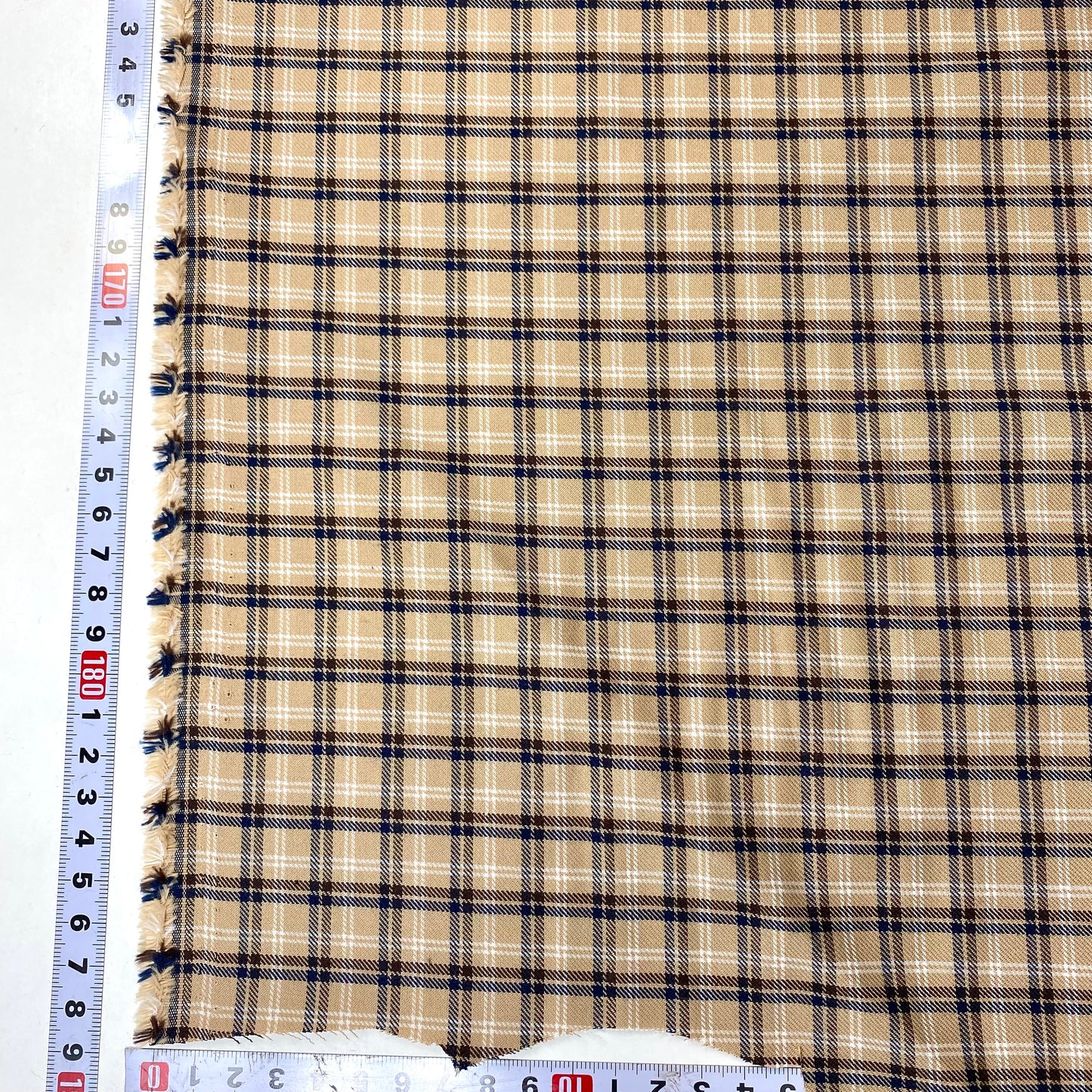 Sarga beige con rayas azules y marrones