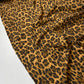 Popeline leopardo preto e dourado