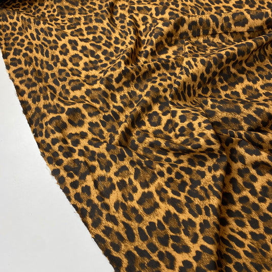 Popeline leopardo preto e dourado