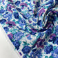 Popelina estampada floral en tonos azules y morados
