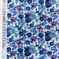 Popelina estampada floral en tonos azules y morados