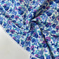 Popelina estampada floral en tonos azules y morados