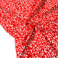 Popelina roja con flores blancas