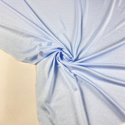 Lycra padrão azul bebé com bolas brancas