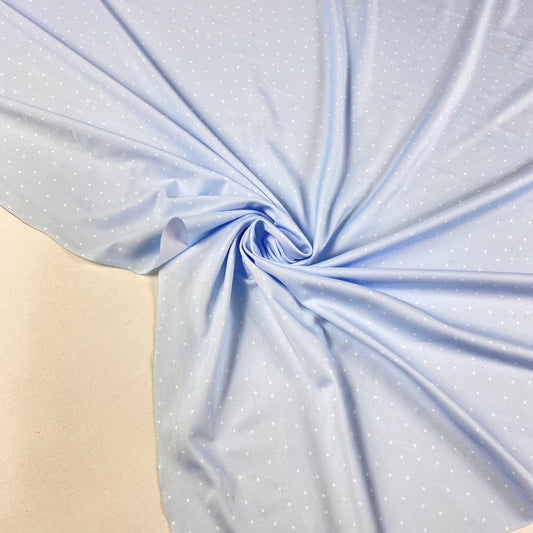 Lycra padrão azul bebé com bolas brancas