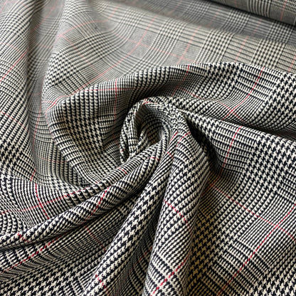 Tartán Príncipe de Gales en blanco y negro con una raya roja.