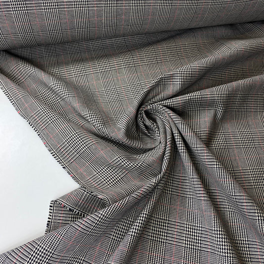 Tartán Príncipe de Gales en blanco y negro con una raya roja.