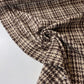Tweed con estrellas marrones y beige y brillo.