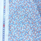 Cambray 100% Algodón Azul Cielo Con Flores Blancas y Rojas