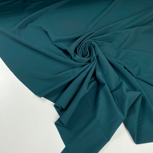 Lycra mate con algunas motas verde petróleo