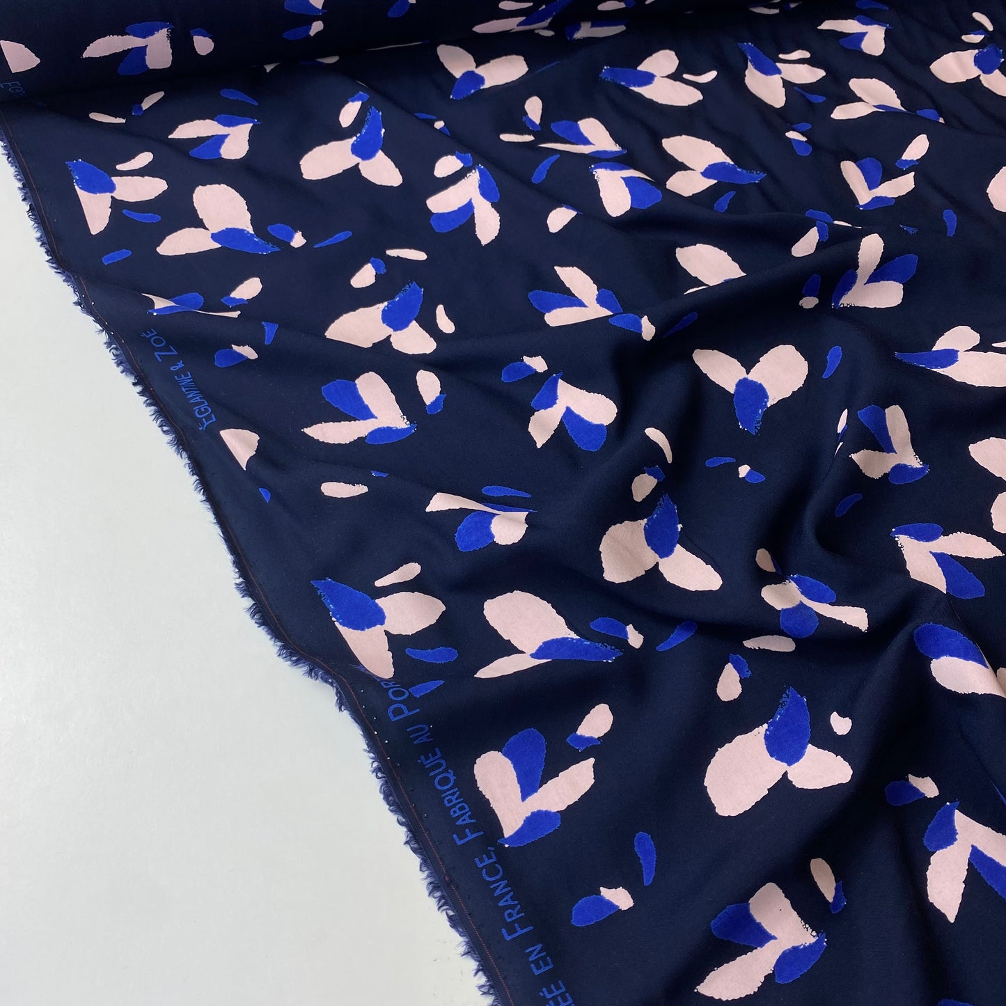 Navy blue poplin with blue and salmon details.