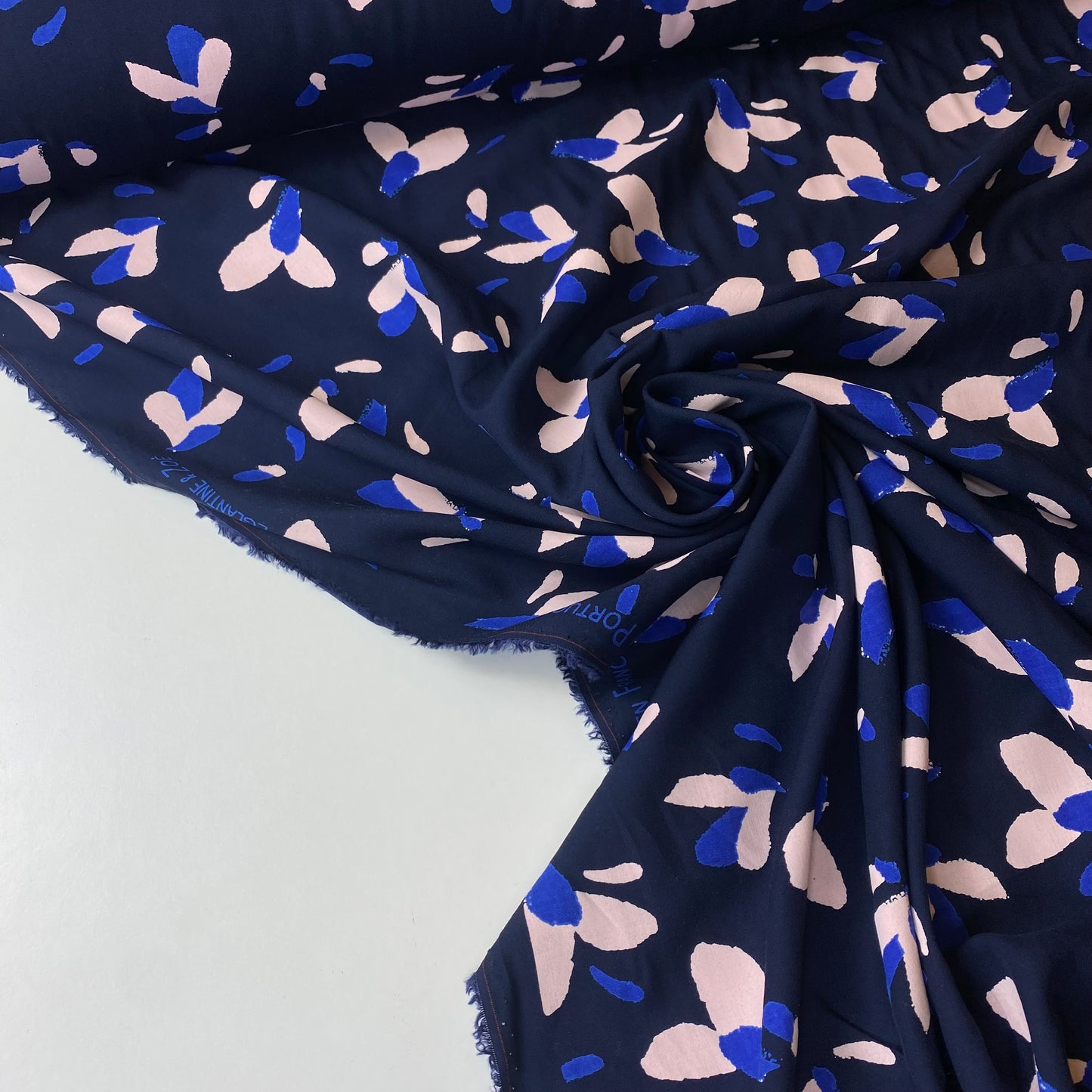 Navy blue poplin with blue and salmon details.