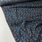 Navy blue poplin with orange, blue, and beige spots.