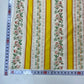 Tela chintz de Alcobaça con rayas blancas y amarillas y cenefas florales.