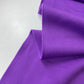 Tejido de punto con polar morado para abrigos o gabardinas.