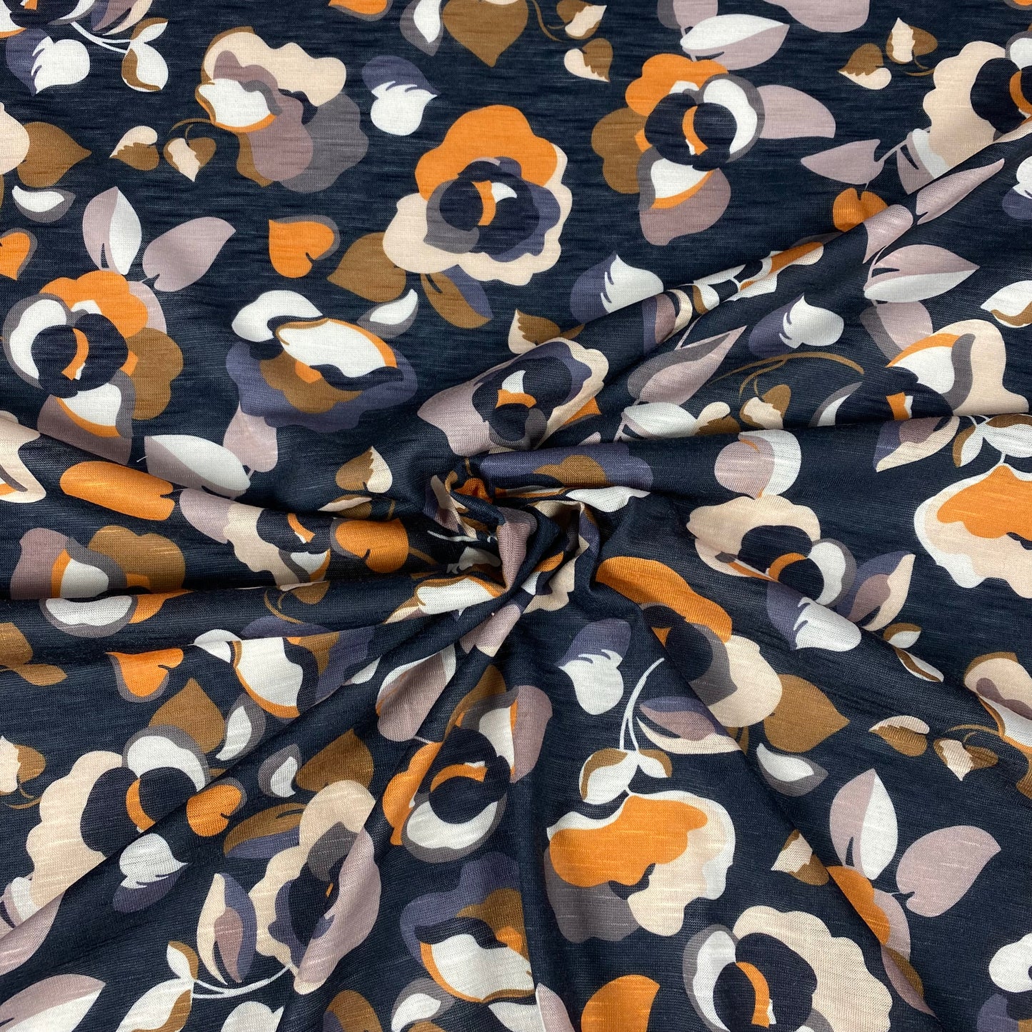 Black viscose jersey with orange and cream flowers