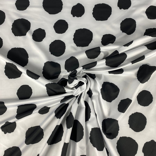 White lycra with black dot pattern