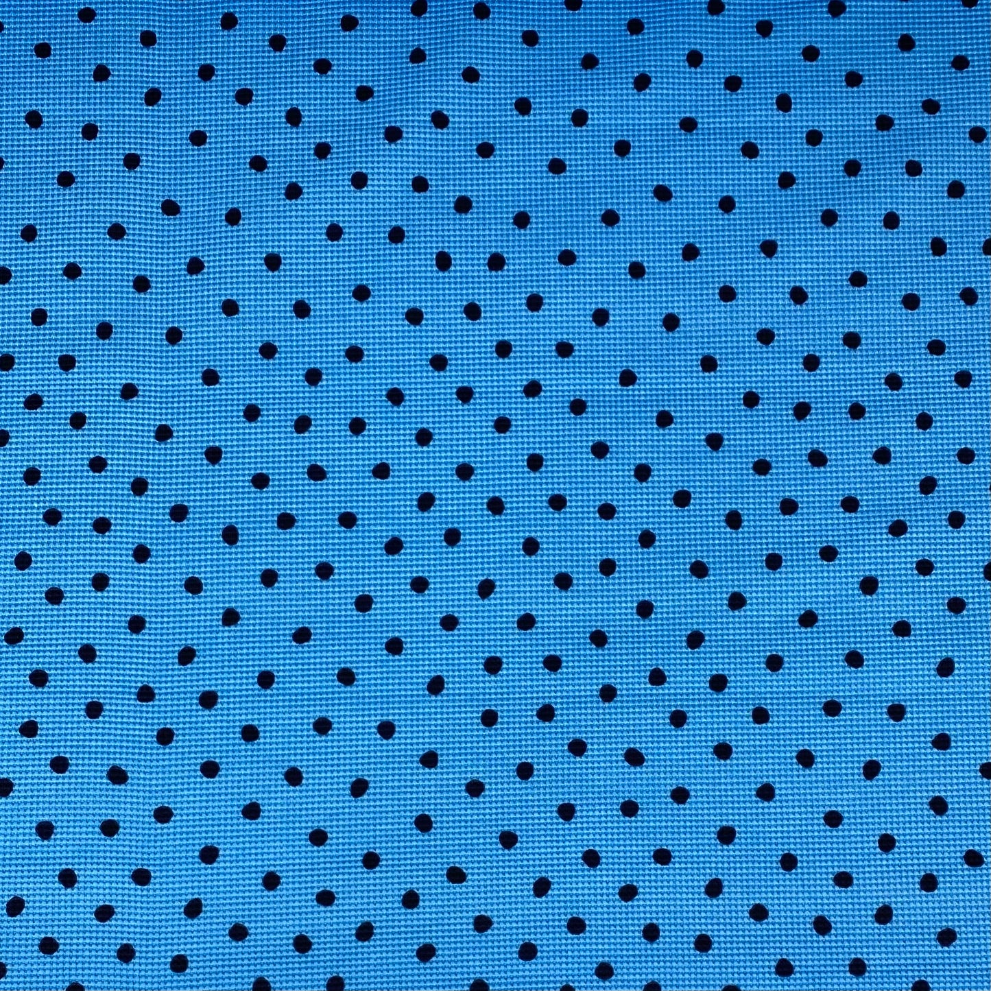 Blue honeycomb mesh with black dots