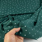 Lycra padrão verde escuro com bolas brancas