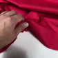Red poplin with some elastane.